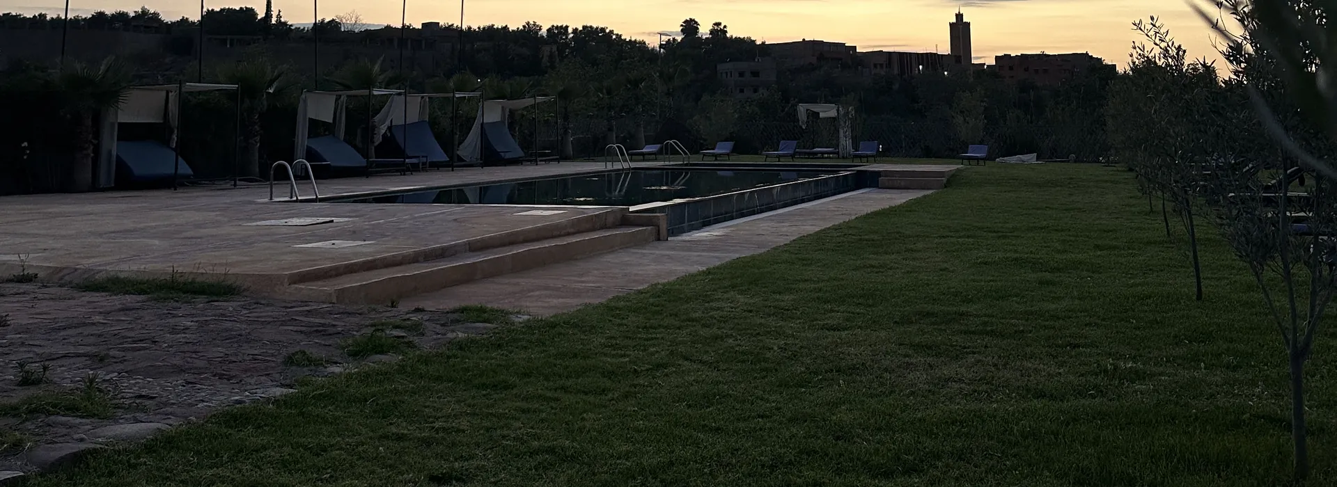 Lawn and pool at dusk