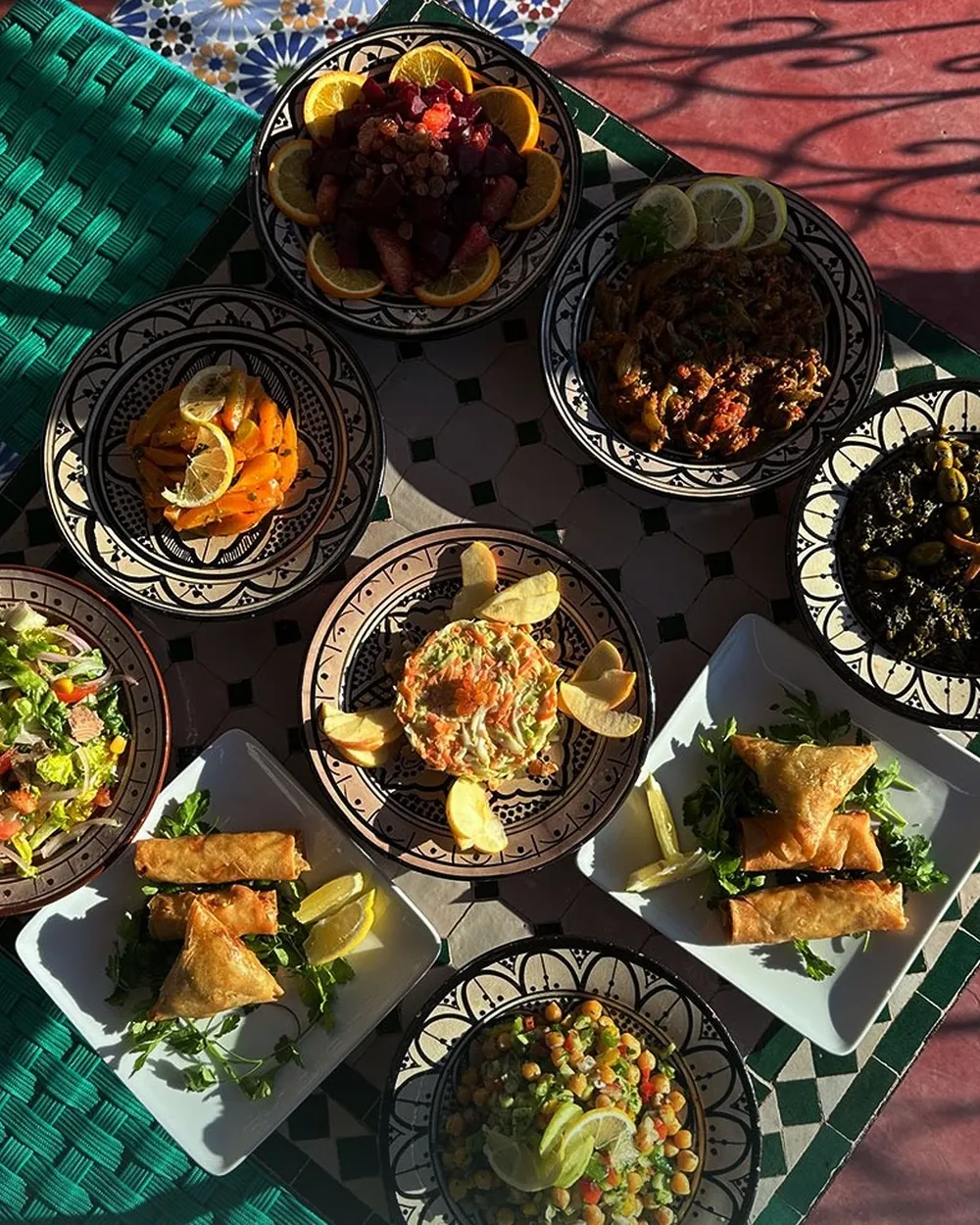 Moroccan dishes laid out on a table